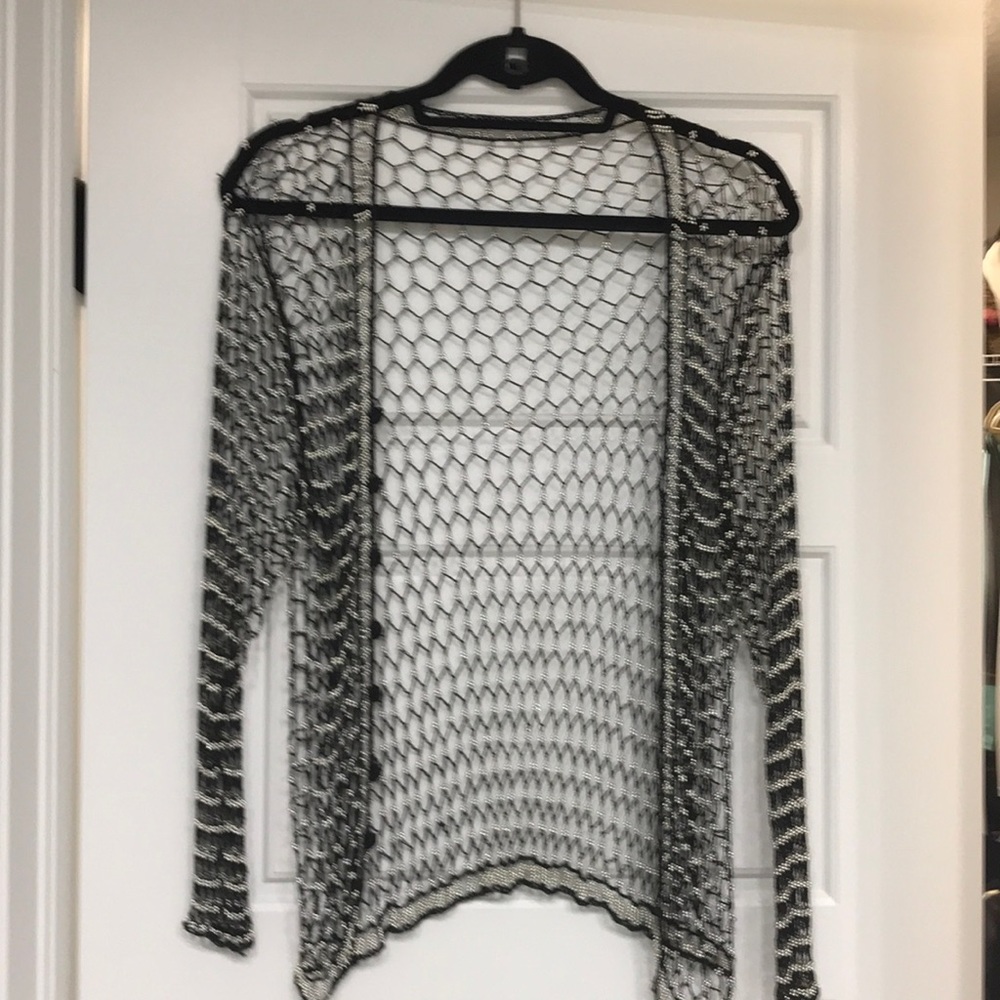 Beautiful pearl & fishnet looking black material.